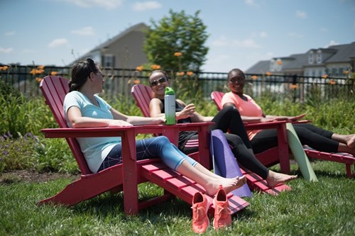 Friends enjoying outdoor space in Embrey Mil