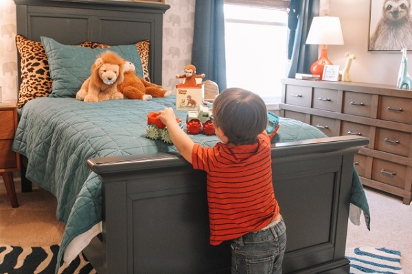 boy playing with stuffed animals